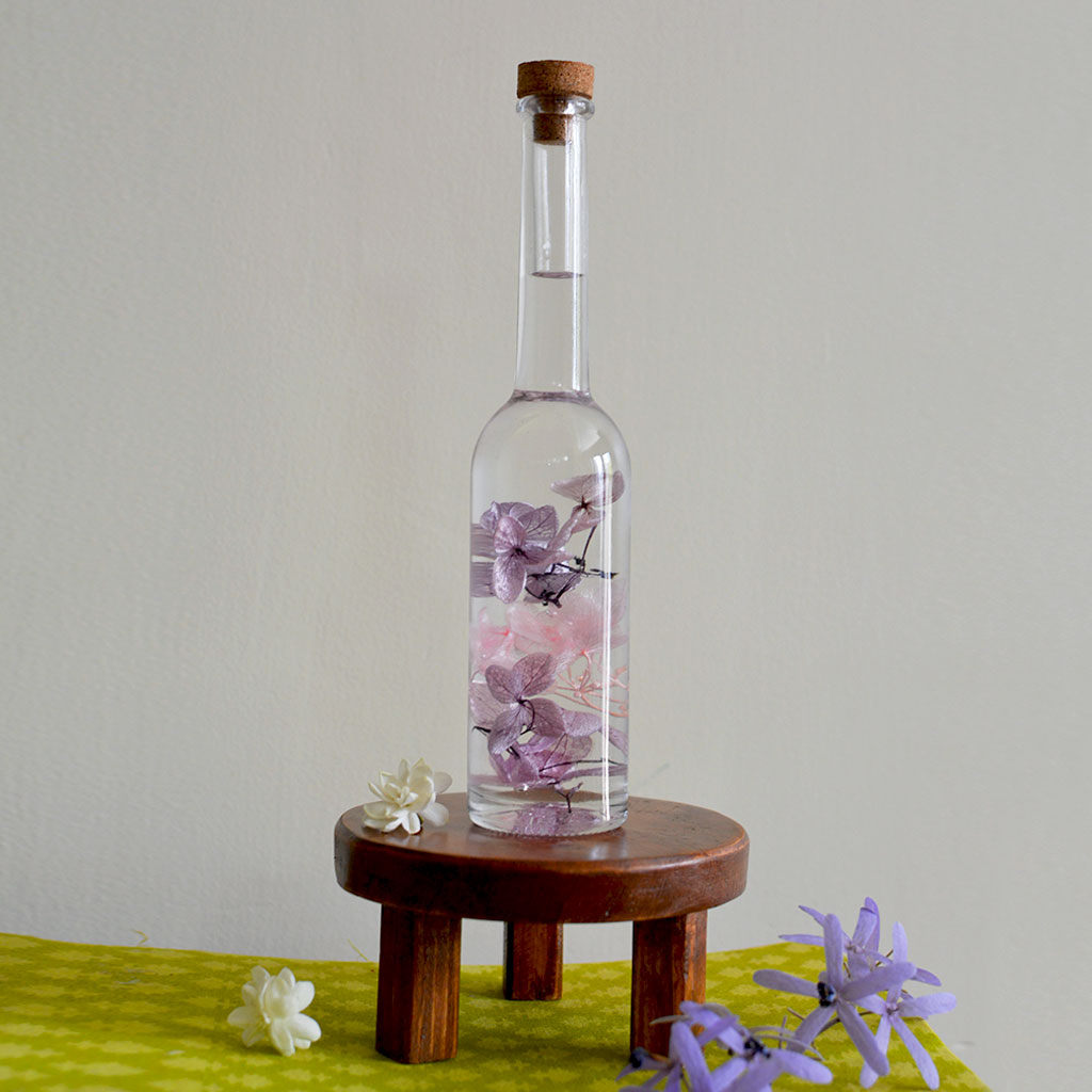 Winsome Strew Preserved Flower Tabletop on circular stand – bright and welcoming décor.