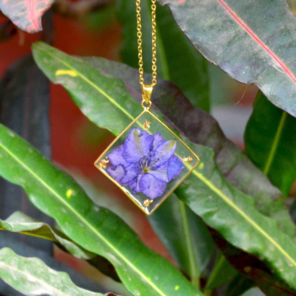 Wisteria Whispers necklace with real lavender-purple dried flowers preserved in clear resin pendant