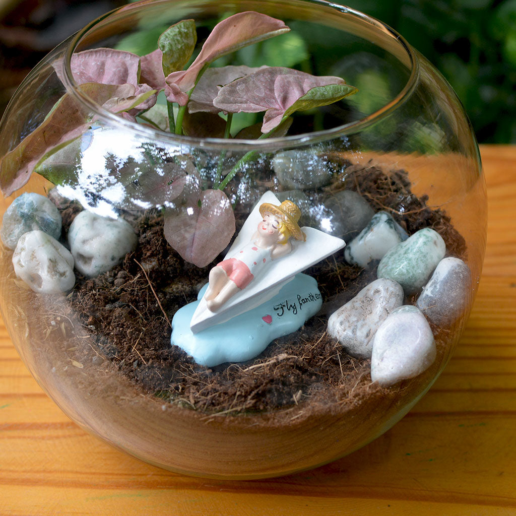 Resin boy lying down figurine