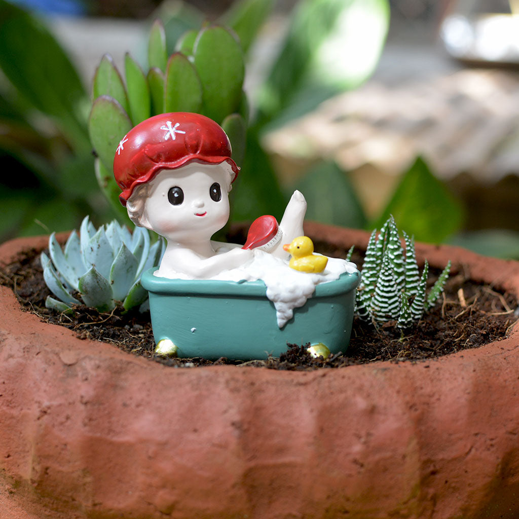 Resin boy bathing figurine