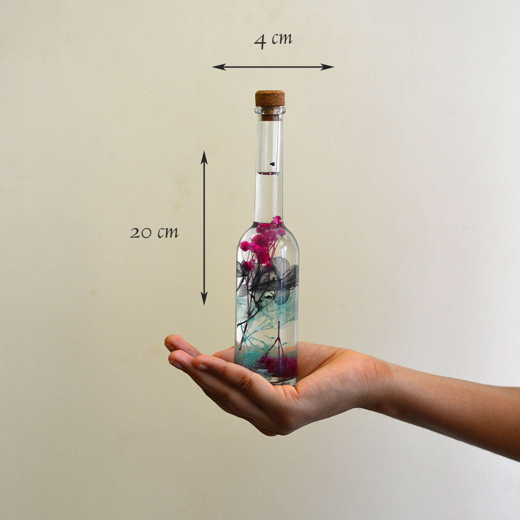 Diablerie Stir Preserved Flower Tabletop shown in hand – striking and intense décor piece.