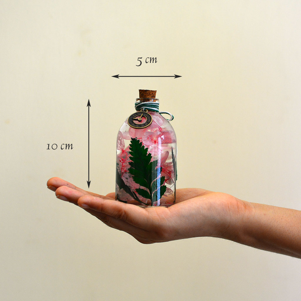 Eternal Flora Preserved Flower Tabletop shown in hand – compact natural décor accent.