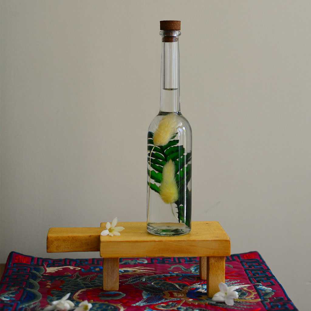 Fluffy Scrubs Preserved Flower Tabletop on rectangular stand – delicate aesthetic display.