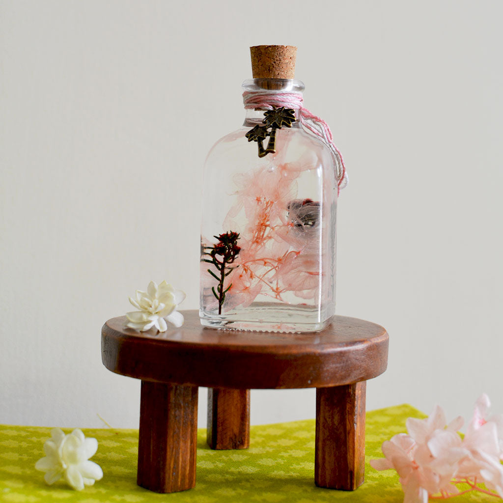 Notes in the Wild Preserved Flower Tabletop on circular stand – soft countryside décor piece.