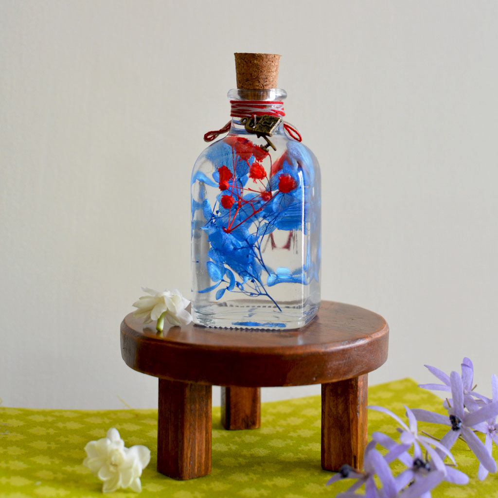 Prismatic Hues Preserved Flower Tabletop on circular stand – vibrant décor element.