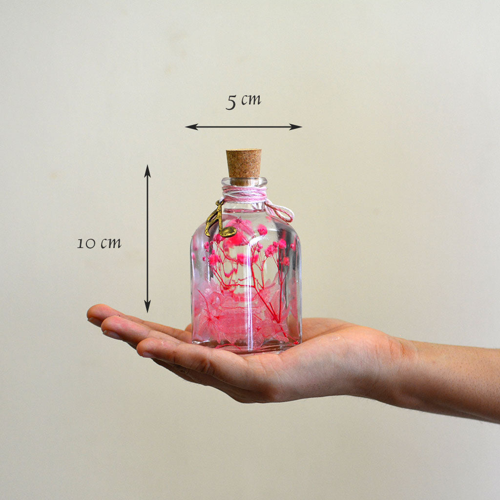 Punky Pinks Preserved Flower Tabletop shown in hand – lively feminine décor piece.