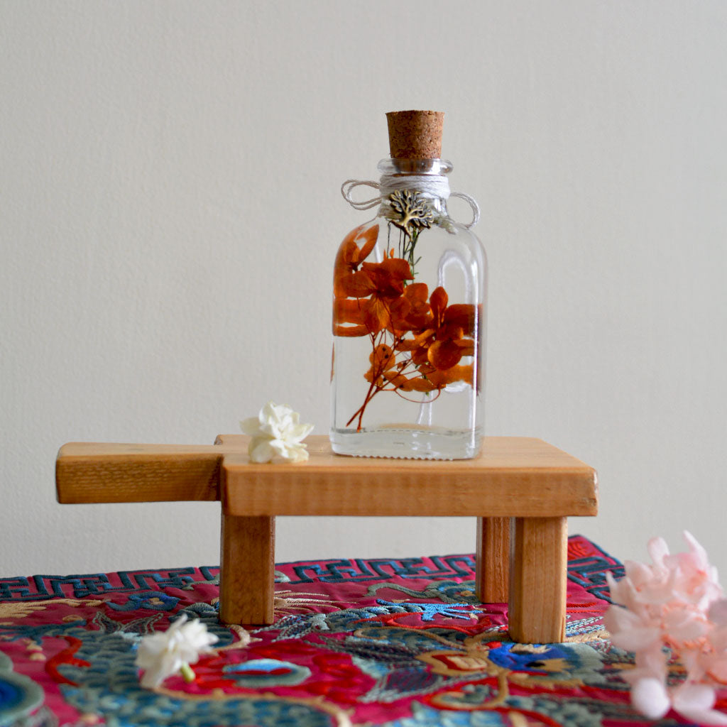 Tangerine Beaut Preserved Flower Tabletop on rectangular stand – joyful preserved display.