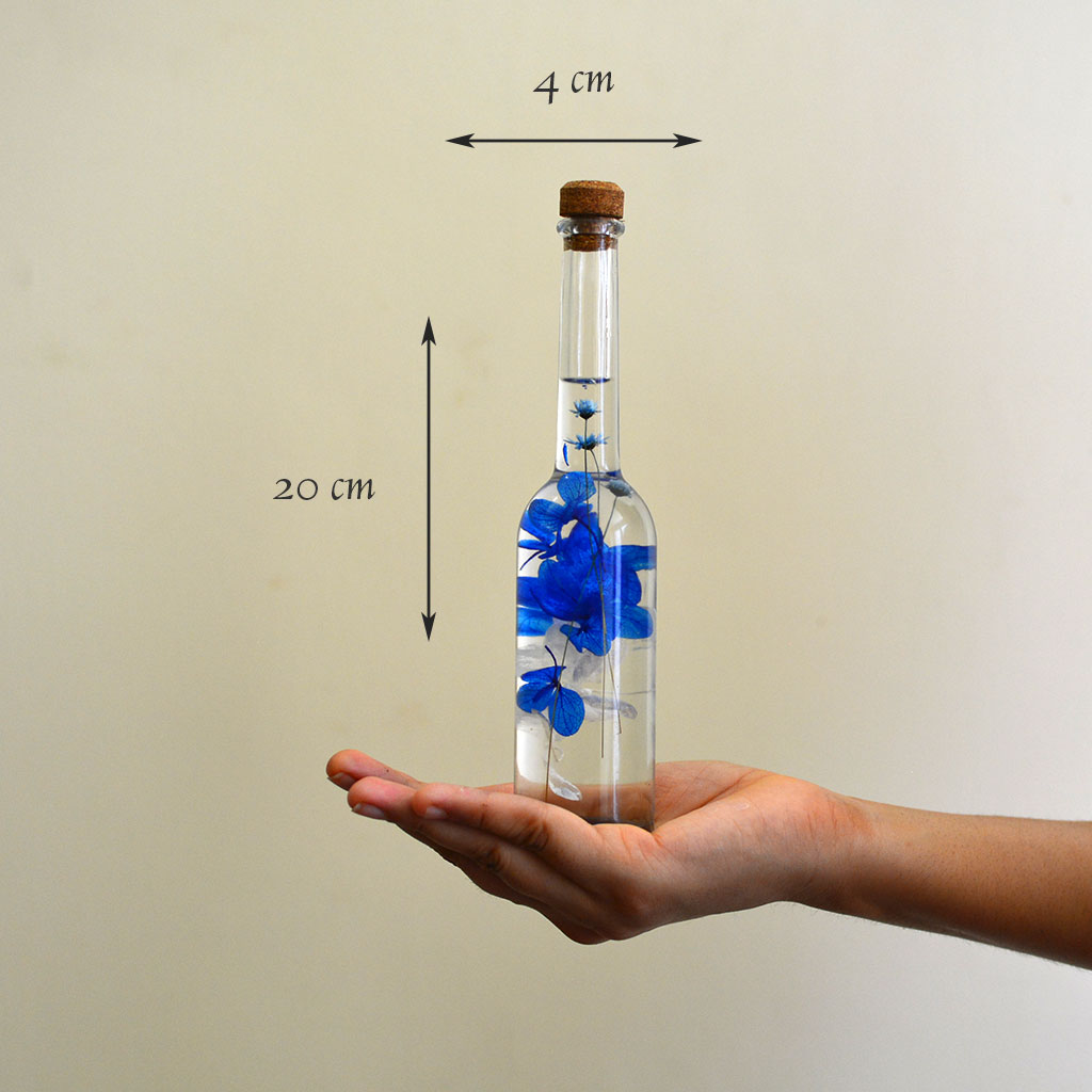 Unfurled Camo Preserved Flower Tabletop shown in hand – compact nature-inspired décor.