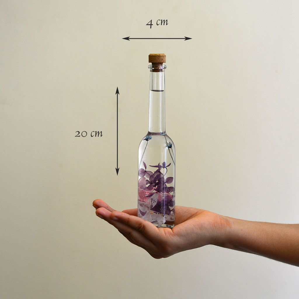 Winsome Strew Preserved Flower Tabletop shown in hand – playful, friendly décor tone.