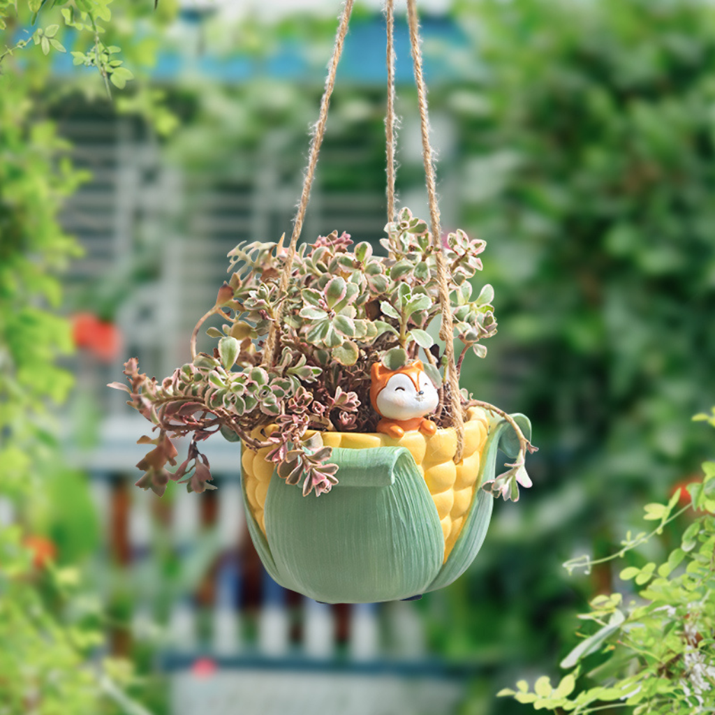 Peeking from a Cob Hanging Resin Succulent Pot