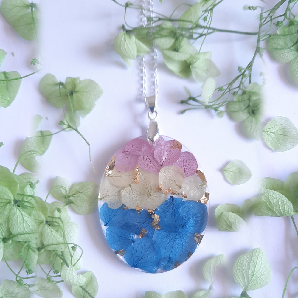 Graceful handcrafted floral necklace featuring real preserved blossoms in glossy resin by myBageecha