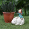 Miniature Girl Sitting on Rabbit Decor