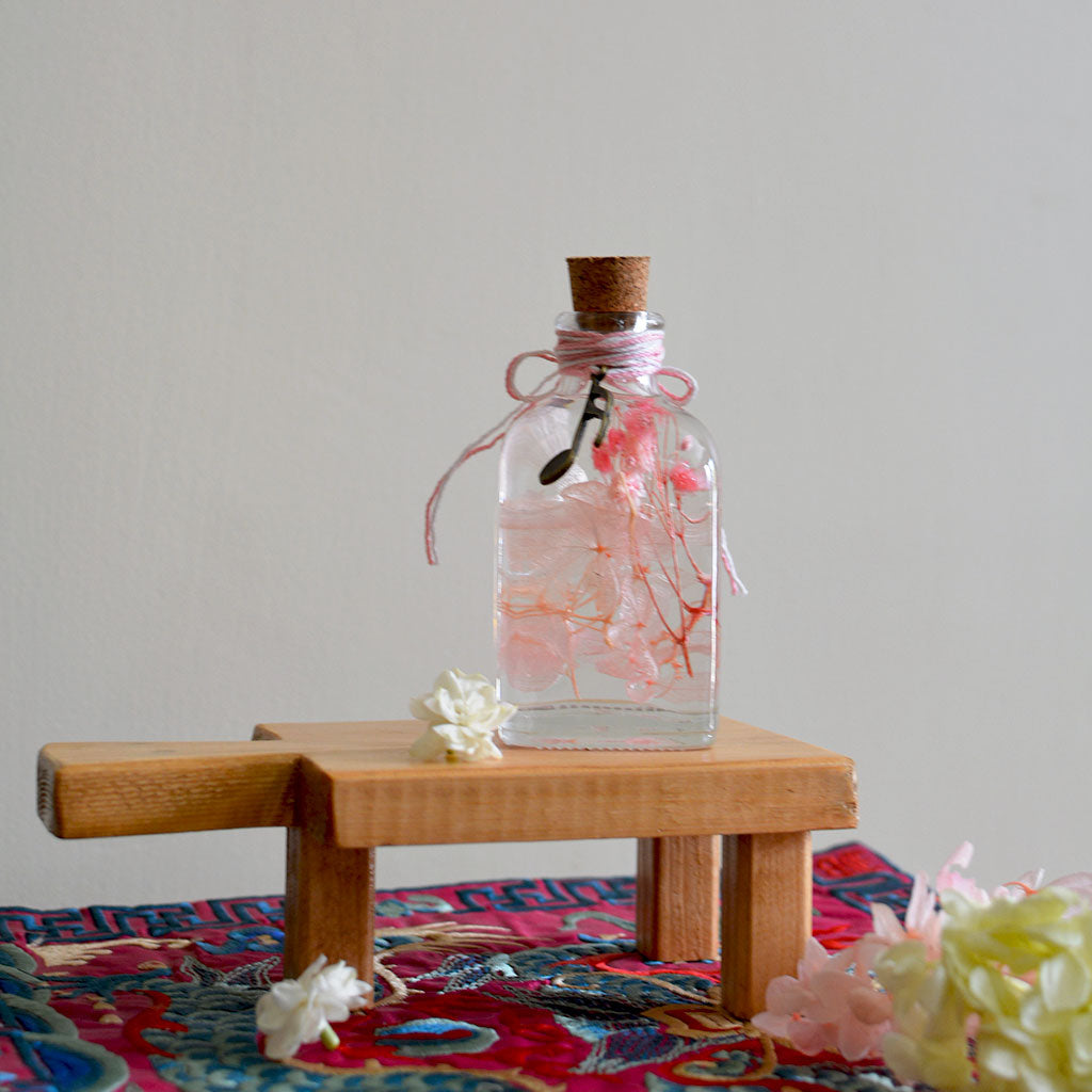 Punky Pinks Preserved Flower Tabletop shown in hand – lively feminine décor piece.